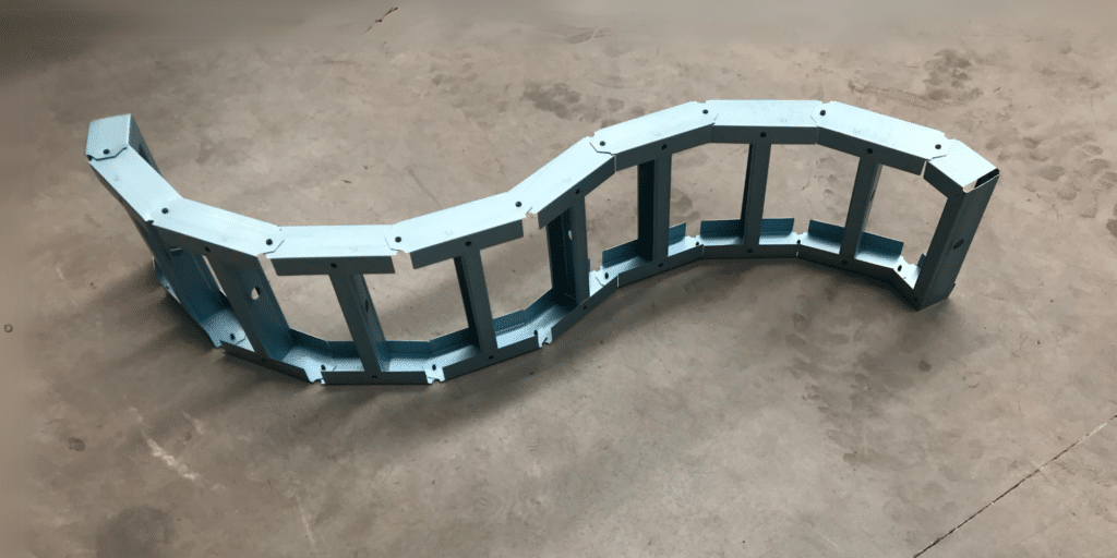 Photo of a loosely curved wall frame made of light gauge steel produced with the ENDUROFRAME® building system